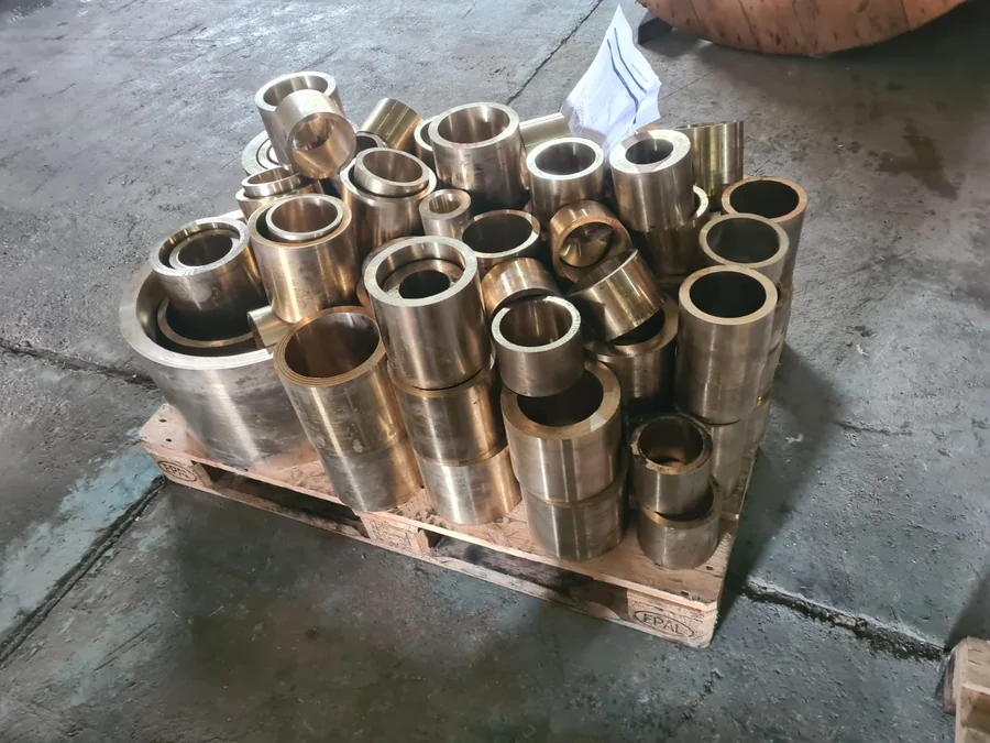 Pallet of cast bronze bushings, bored and faced