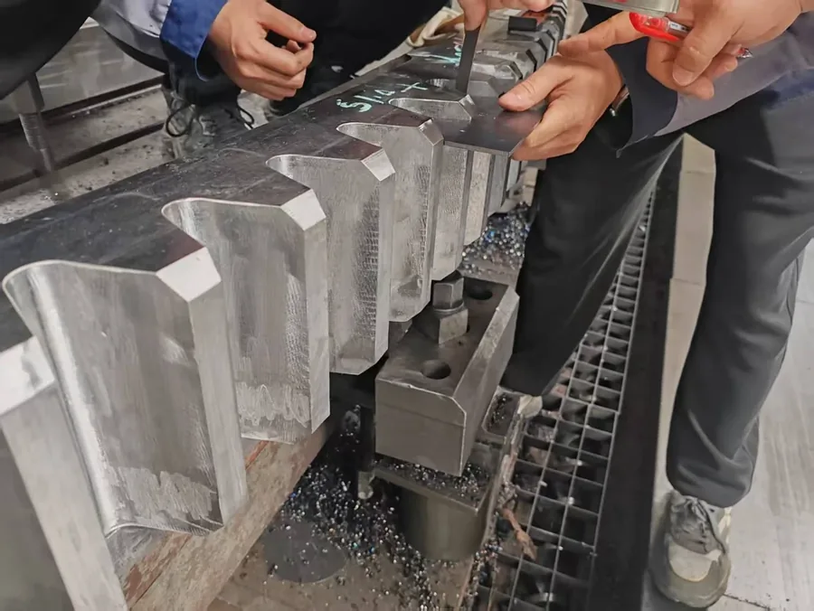 Machined wear segments being measured on the machine bed