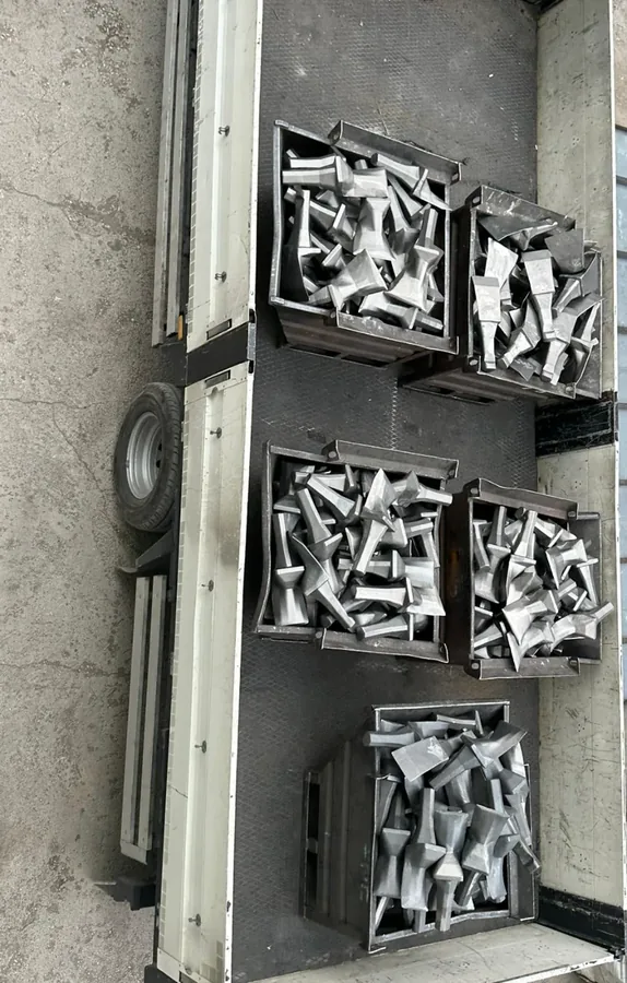 Crates of cast bucket teeth loaded for dispatch